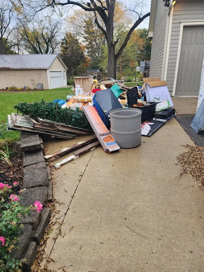 Dumpster being loaded with debris for 30 Yard Dumpster Rental in Pikeville
